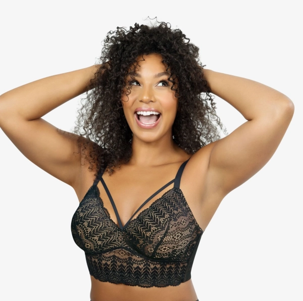 Czarny biustonosz bralette Brafitteria typu longline z ozdobnymi paskami przy dekolcie.