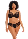 Modelka plus size prezentuje pełne, czarne figi z transparentnej siateczki tiulowej.