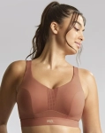 Biustonosz sportowy w kolorze pudrowego różu na modelce, półprofil.